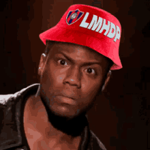 a man wearing a red hat that says lmhp
