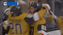 a hockey game is being shown on sn and the players are hugging each other