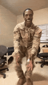 a man in a military uniform is dancing in front of a wall with a schedule on it
