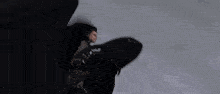 a person is flying through the air in a dark room with a blurred background .