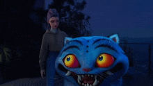 a woman standing next to a blue cat with orange eyes and teeth