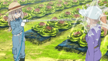 a girl in a blue jumpsuit is spraying water on a field of plants