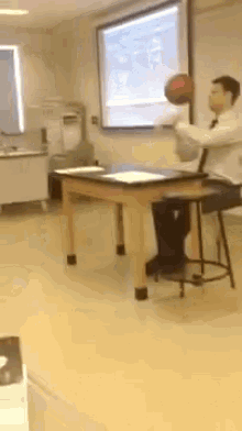 Teacher Grades Papers While Spinning A Basketball GIF - Teacher Basketball Grade GIFs