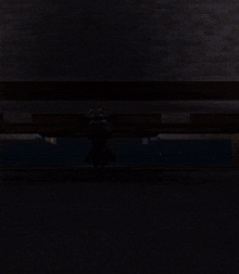 the word dim is displayed in a dark room
