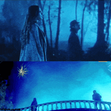 a man and a woman are standing on a bridge in a dark forest with a star in the background