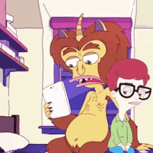 a cartoon character is sitting on a bed next to a boy holding a tablet .