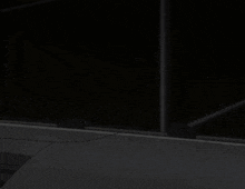 a girl in a black hat with a cross on it is hanging upside down