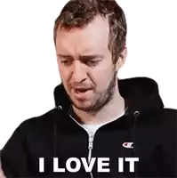 a man wearing a black champion sweatshirt says i love it