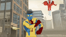 a man in a yellow and blue superhero costume is standing in front of a building