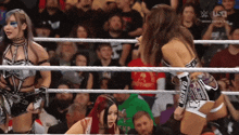 a woman in a wrestling ring with the word usa on the screen