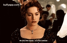a woman is wearing a necklace and a dress and says no one who cared or even noticed .