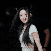 a girl with long black hair wearing cat ears