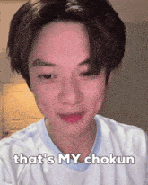 a young man says that 's my chokun in a white shirt
