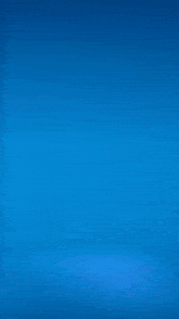 a man is standing in front of a blue background that looks like ice