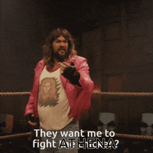 a man in a pink jacket is standing in a boxing ring and says " they want me to fight athena "