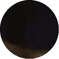 a pixelated image of a person 's face in a dark circle