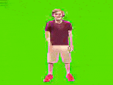 a man is standing in front of a green screen .