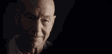 a close up of a man 's face with the words " very proud of you " below him