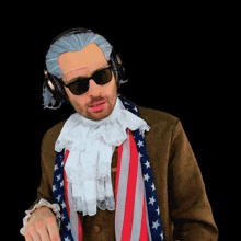 a man wearing a wig and sunglasses is wearing headphones and an american flag scarf