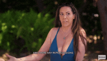 a woman in a blue swimsuit says are there any repercussions on bravo