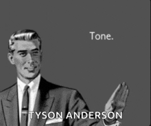 a man in a suit and tie with the name tyson anderson written on the bottom