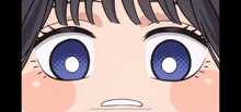 a close up of a person 's eyes with a white circle in the middle