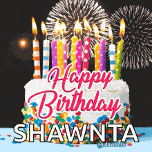 a birthday cake with candles and fireworks in the background for shawnta .