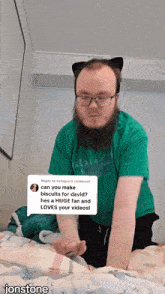 a man with a beard and cat ears is laying on a bed with a reply to xvilpee 's comment