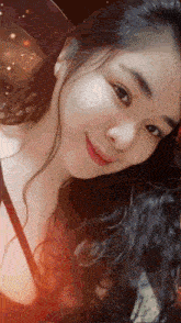 a close up of a woman 's face with a blurred background