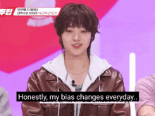 a young man in a brown leather jacket says honestly my bias changes everyday