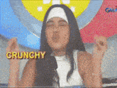a woman in a nun costume with the word crunchy on the bottom right