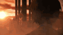 a man in a suit stands in front of a sunset while another man stands behind him