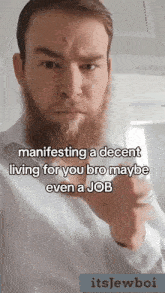 a man with a beard is giving a thumbs up sign