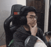 a man wearing headphones with the word next on the back