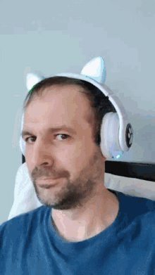 a man wearing a pair of headphones with cat ears