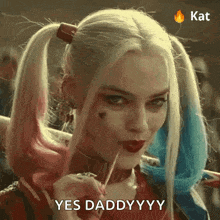 a woman in a harley quinn costume is holding a lollipop and saying `` yes daddyyy '' .