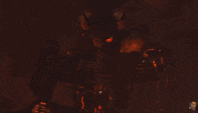 a computer generated image of a large explosion with a picture of a man in the corner