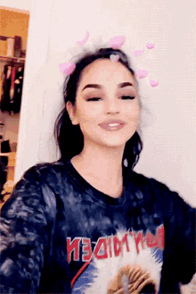 a woman wearing a shirt that says heavy metal