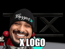 a man wearing a black beanie that says blazord x on it