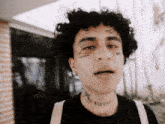 a man with a tattoo on his neck says eternal