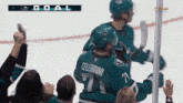 a hockey player with the name celebrini on his back