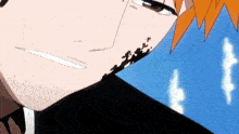 a close up of a person 's face with a blue sky in the background .