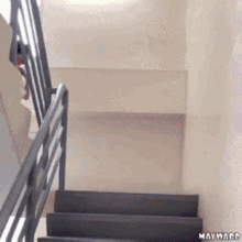 a staircase with the words mayward on the bottom right