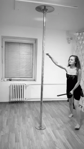A witch pole dances on a broom