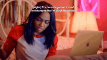 a woman sitting in front of a laptop with the words " my parents got me locked in this room