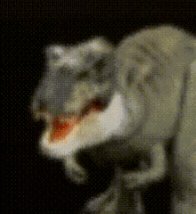 a pixelated image of a dinosaur with its mouth open .