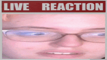 a close up of a person 's face with a live reaction sign above it