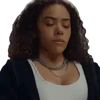 a woman with her eyes closed wearing a necklace and a black jacket
