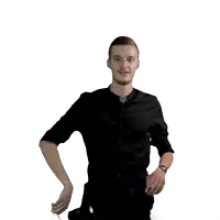 a man in a black shirt is shaking a drink