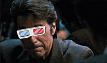 a man wearing a pair of 3d glasses looks at something